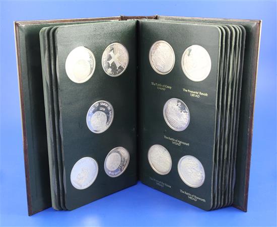 A Danbury Mint History of the English-Speaking Peoples set of 50 silver medallions, in folder with cards, number 2719 of 7500.
